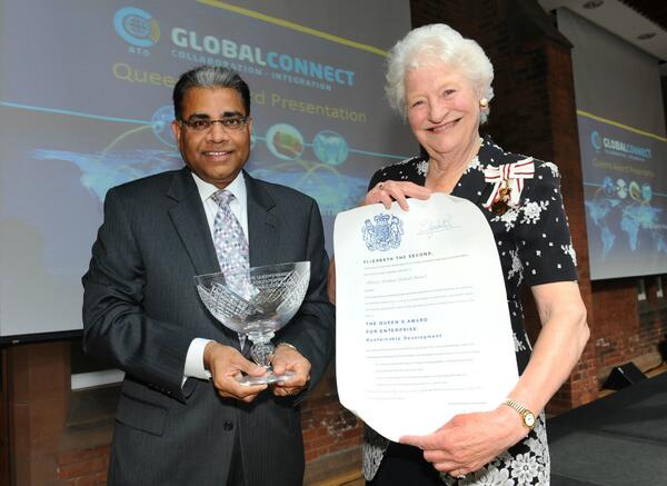 Dame Mary Peters, presents the award to Allstate's Suren Gupta
