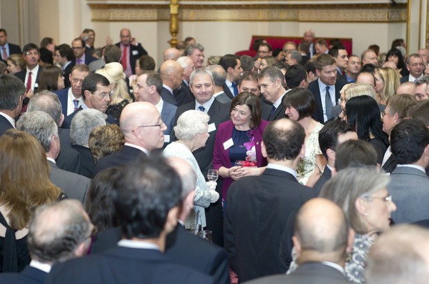 Linda Stephens speaks to The Queen at Buckingham Palace during the reception for the Queen's Awards 2012.
