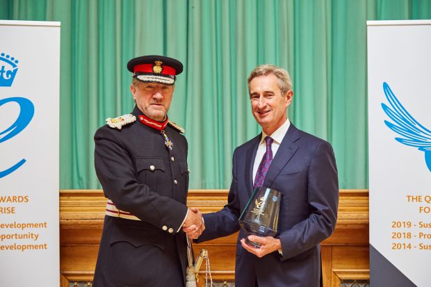 Rick Willmott accepting the Queen's Award from Lord Lieutenant, Sir Robert Voss.